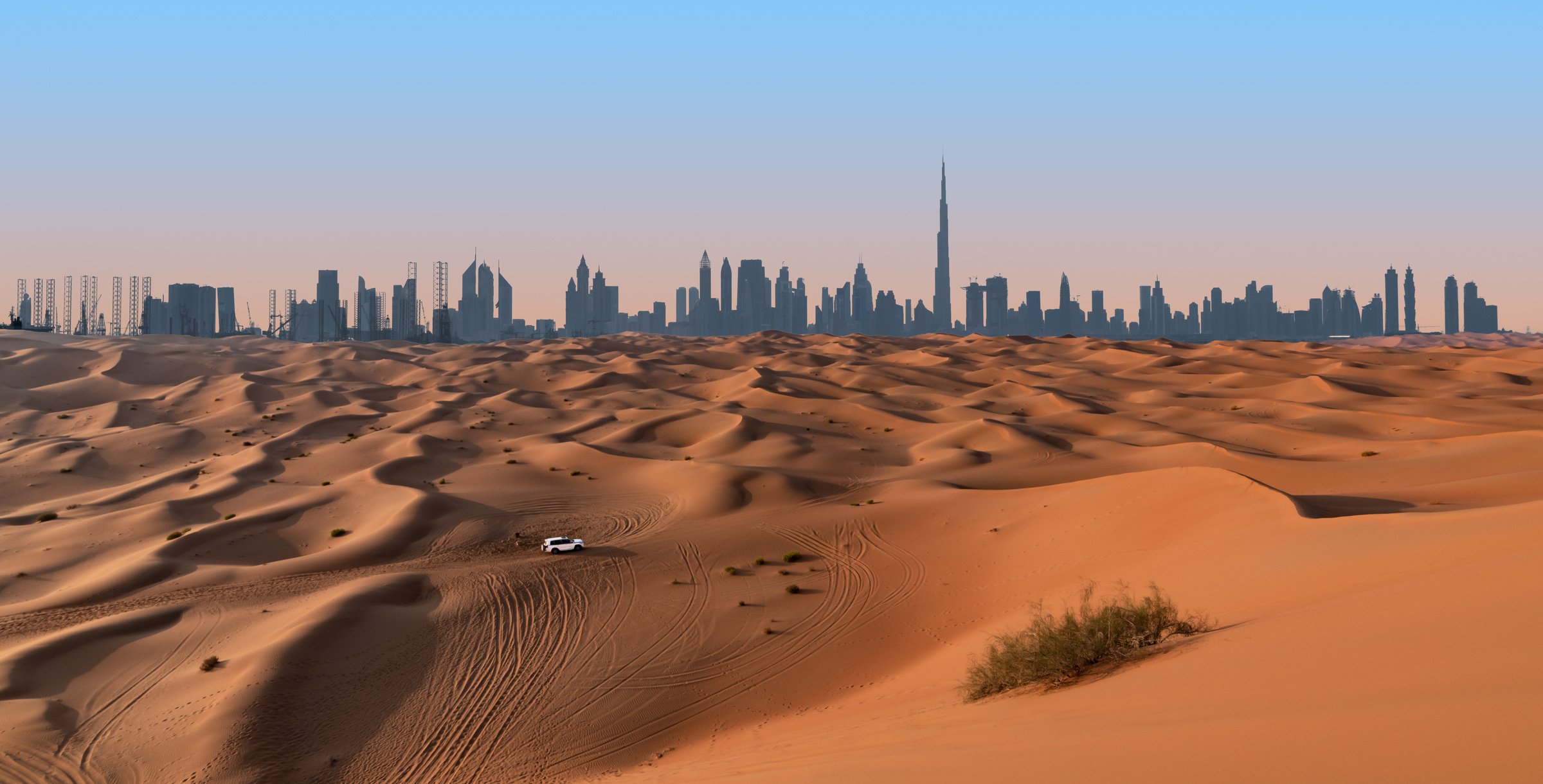 Dubai skyline and desert landscape.