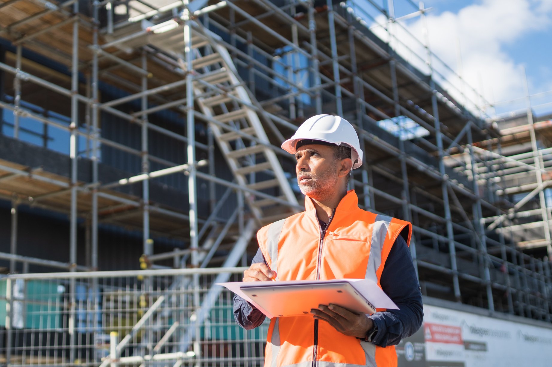 Construction manager controlling building site.